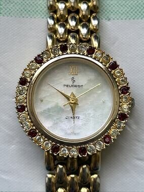 Peugeot MOP Dial Rhinestone Bezel Women’s Quartz Watch